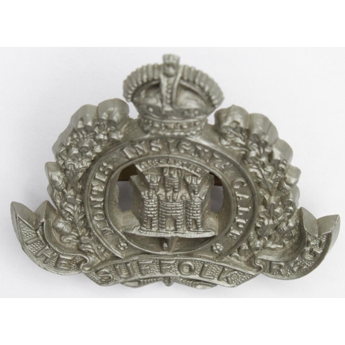 928 - Suffolk Regt O/R's cap badge, KC, grey plastic