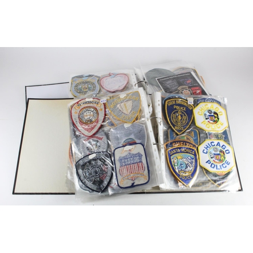 946 - United States cloth Police patches housed in two packed binders.  (approx 300)