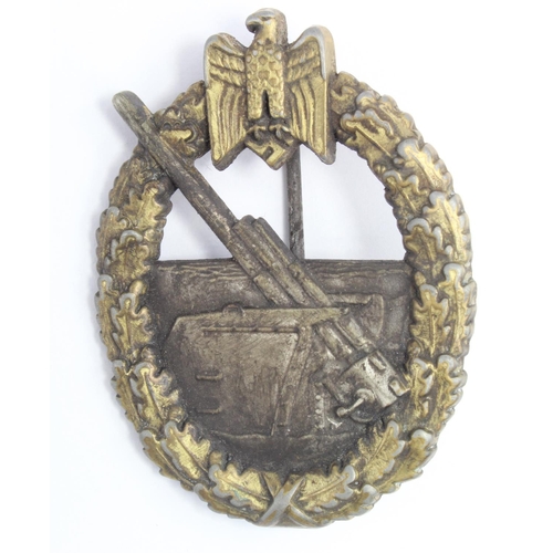 1045 - WW2 Kriegsmarine Ersatz Issue Coastal Artillery Badge. Made in Tombac with gold painted laurels.