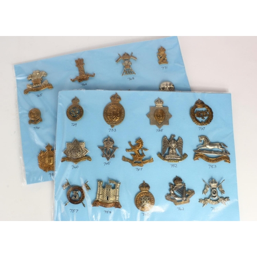 281 - Cap Badges on a blue cards - Cavalry badges all with K&K numbers.  (27)