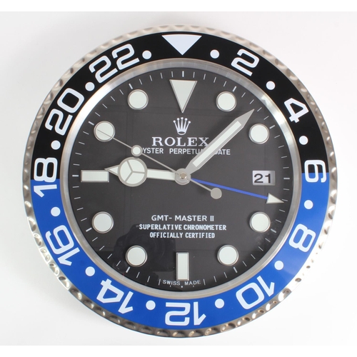 137 - Advertising Wall Clock. Blue, black & chrome 'Rolex' advertising wall clock, black dial reads 'Rolex... 