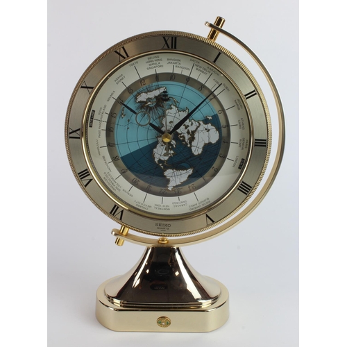 138 - Seiko quartz World clock, height 30cm, width 21cm approx. (working at time of cataloging)