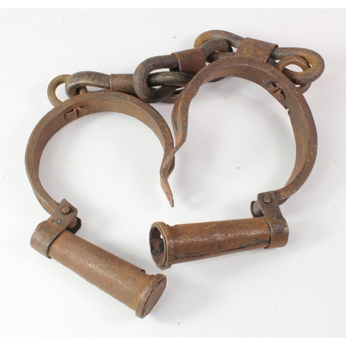 429 - Slavery interest. A pair of slave ankle shackles, possibly for a child, key missing, diameter of eac... 