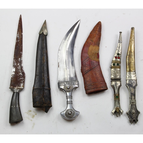 1089 - Eastern Daggers - an attractive lot of three Arab Jambiya Daggers in their scabbards and an Indian D... 