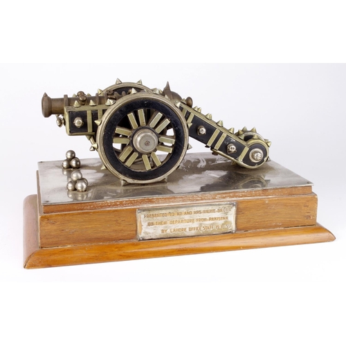 1112 - Model Cannon on plinth, with plaque 'Presented to Me and Mrs Wilkie-Brown on their departure from Pa... 