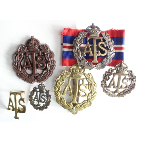 1484 - ATS plastic hat badge with a selection of other ATS hat and lapel badges.