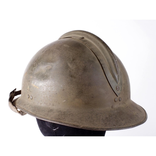 1802 - French WW2 helmet with liner and chinstrap, badge missing.