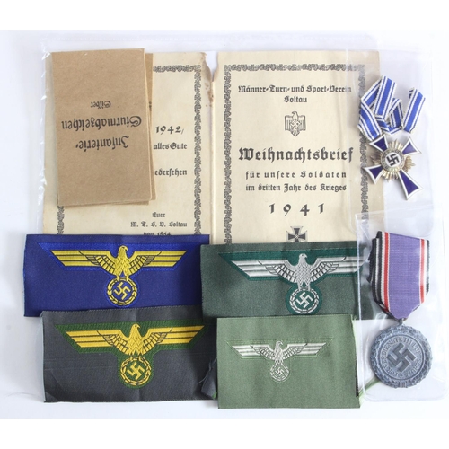 1905 - German Mothers Cross in bronze together with a Luftschutz medal, various cloth badges and booklet et... 