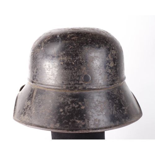 1922 - German Nazi Civil Defence helmet with liner and chinstrap, named inside to 'v. Loon' and stamped 'RL... 