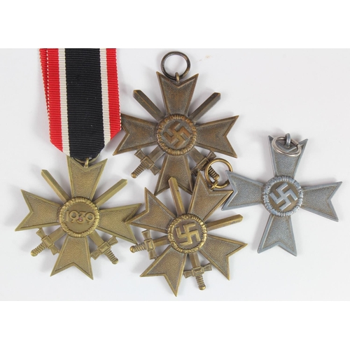 1940 - German Nazi Merit Cross Medal with Swords x3, one maker marked '95', and without Swords x1. All 2nd ... 