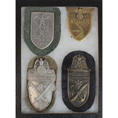 1941 - German Nazi metal arm badges inc Cholm 1942, Kuban 1943, Narvik 1940 and Demjansk 1942. Housed in sm... 