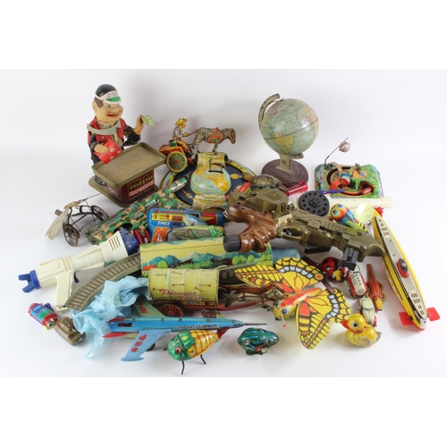 102 - Tinplate toys. A collection of approximately twenty-five original and reproduction tinplate toys, in... 