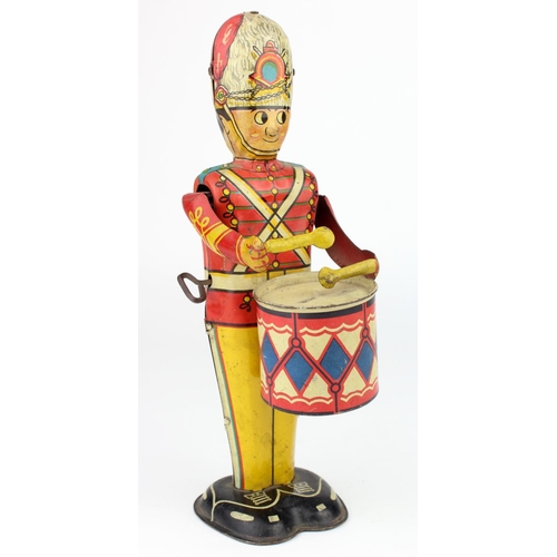 80 - Marx tinplate clockwork guardsman drummer, height 23cm approx. (working)