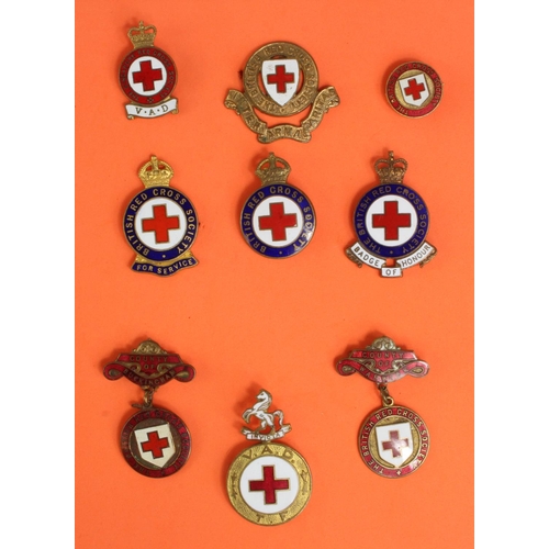 1495 - Red Cross a selection of badges inc VAD TF cap badge.