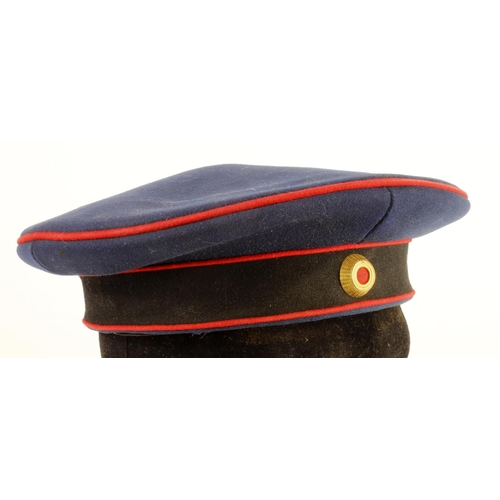 1645 - WW1 German soldiers dress hat in blue with red piping.