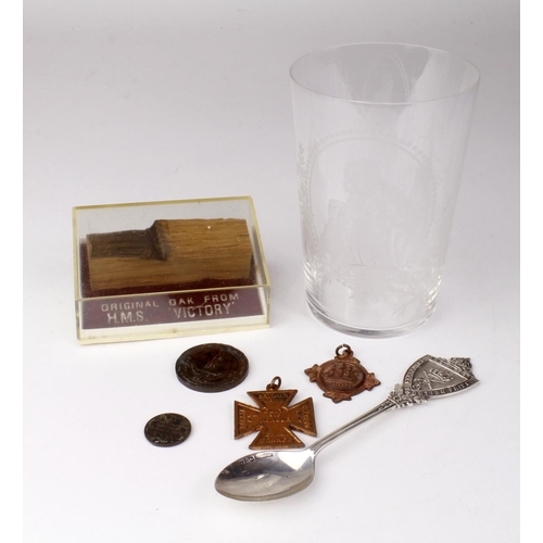 774 - Lord Nelson / H.M.S. Victory related items comprising a Commemorative Glass, a piece of H.M.S. Victo... 