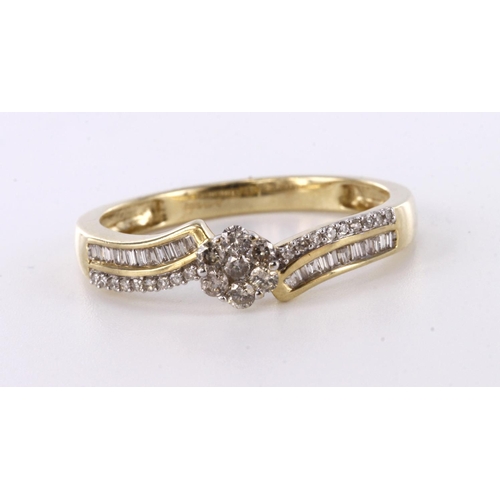 75 - 9ct yellow gold crossover style diamond set ring, with a central diamond cluster and further round a... 