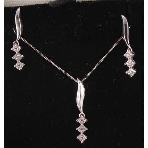 78 - 9ct white gold matching diamond trilogy pendant and drop earrings set, on a 9ct white gold chain, le... 