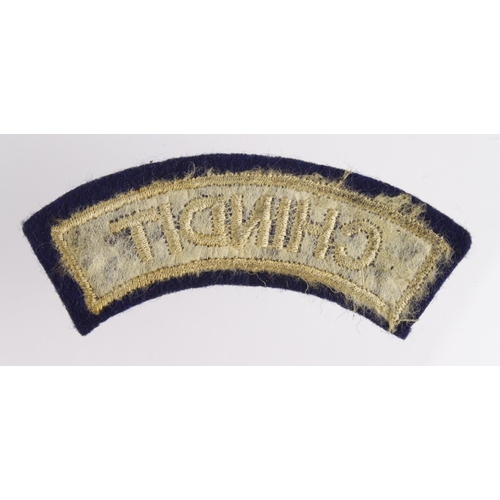 1620 - Cloth Badge: Chindit WW2 embroidered felt shoulder title badge in excellent worn condition.