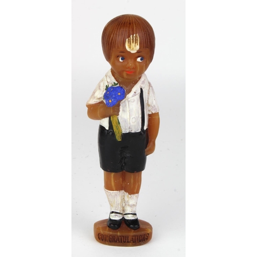 1054 - Unusual 1930's/40's figural soap bar of small school boy holding a bunch of blue flowers. Front of b... 