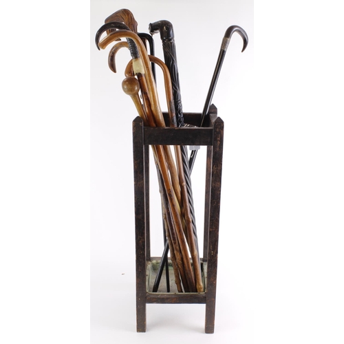 1058 - Walking sticks. A collection of ten various walking sticks, a couple with silver mounts (sold as see... 