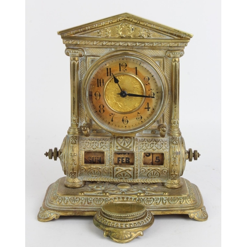 519 - Brass desk clock with intergrated calendar and inkwell, height 22cm, width 18cm, depth 14cm approx.