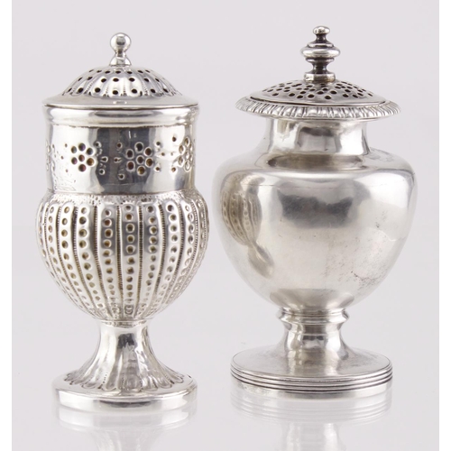 597 - Two Georgian silver peppers, hallmarked for London, 1799 and 1818. The urn-shaped pepper has slight ... 