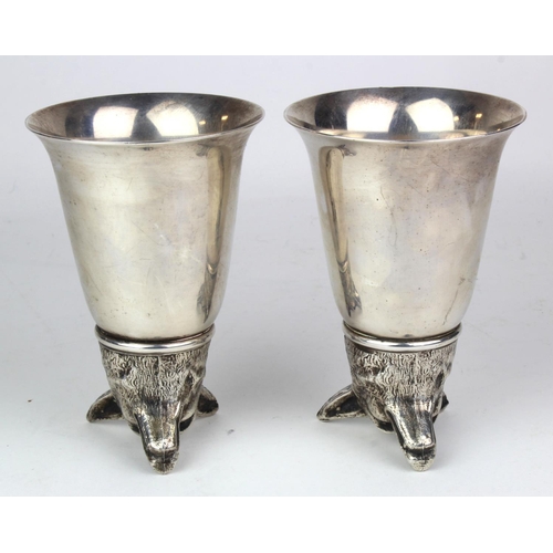 605 - Pair of heavy white metal fox head stirrup cups. Stamped Italy, approx 13cm in height