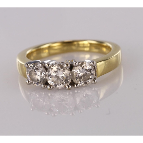 65 - Yellow metal stamped 750 three stone Diamond set Ring approx 0.75ct weight size J weight 4.8g