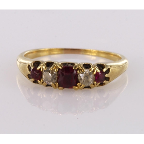 87 - 18ct yellow gold ruby and diamond graduated five stone ring, finger size L, weight 2.5g