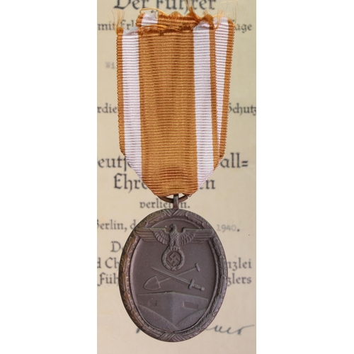 1578 - German West Wall medal in packet with award document Dem Einschaler Willy Schneider Aus Northeim dat... 