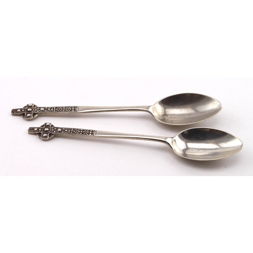 555 - Oban, two Celtic Cross silver teaspoons marked 