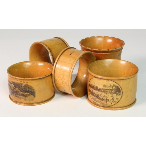 888 - Mauchline ware; Lowestoft, Bath, Lyme, Whitby, all napkin rings in boxwood.