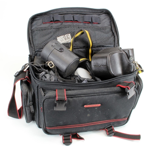 898 - Photography equipment. A group of photography equipment, including two cased cameras (Nikon EM & Pra... 