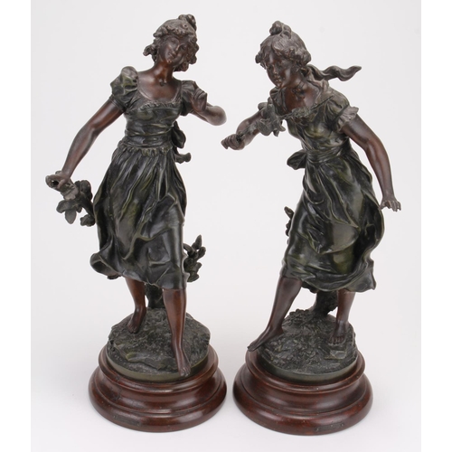 910 - Two decorative spelter female figures, on turned wooden bases with small plaques read 'Chant du Prin... 