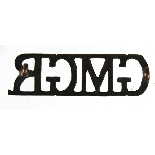 188 - Badge: GMGR - Guards Machine Gun Regiment rare WW1 shoulder title badge. In use from February 1918 u... 