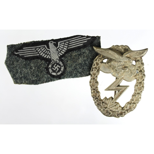 606 - German Nazi cloth eagle sleeve badge ?, and a Luftwaffe Ground Assault badge. (2)