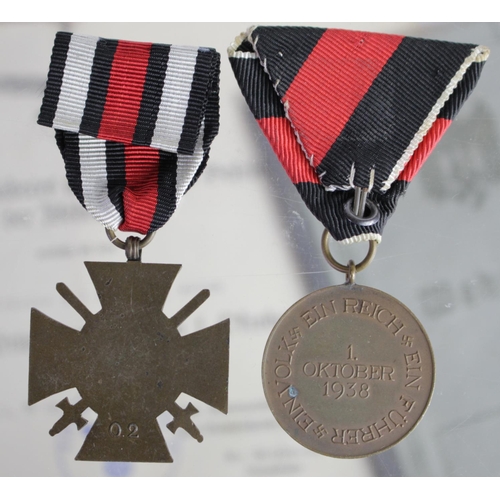 804 - German WW2 Luftwaffe 1st October 1938 medal with award document and cross of honour with award docum... 