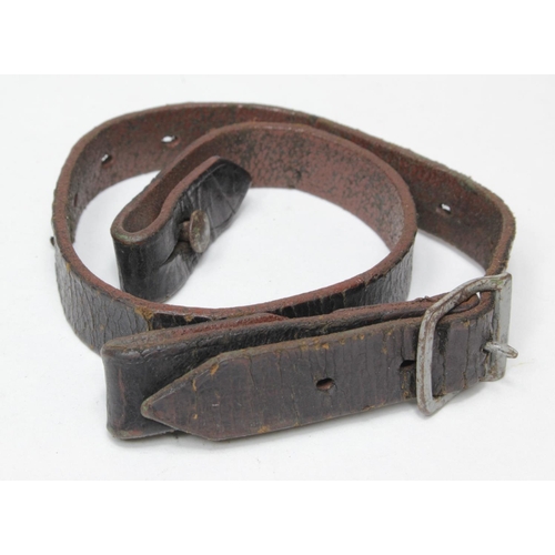 811 - German WW2 original helmet chin strap in good condition, leather cracking with age