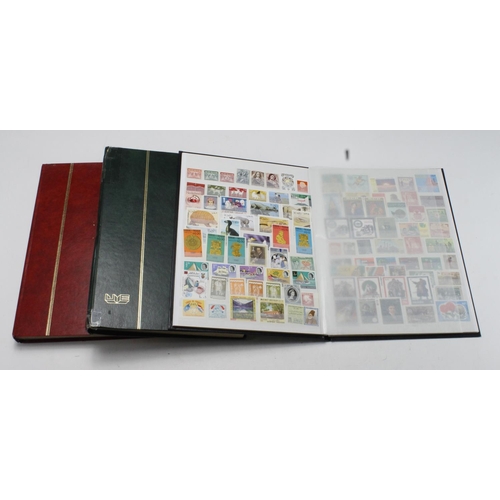 105 - Green stockbook with better material cat £700+, black stockbook with much UM various, and red stockb... 