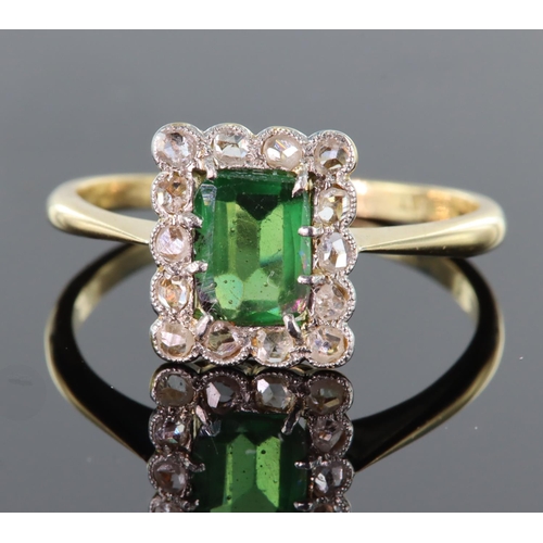 62 - 18ct and platinum rectangular shaped ring set with central green stone surrounded by fourteen mine c... 