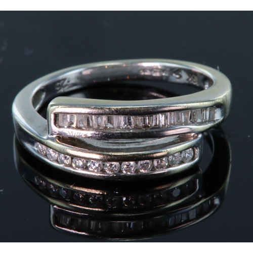 67 - 18ct white gold double channel set ring set with round and baguette cut diamonds with a total diamon... 