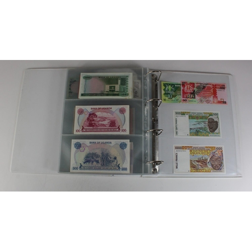 905 - World, Africa (151) a superb collection of Uncirculated notes in an album, Algeria, Angola, Biafra, ... 