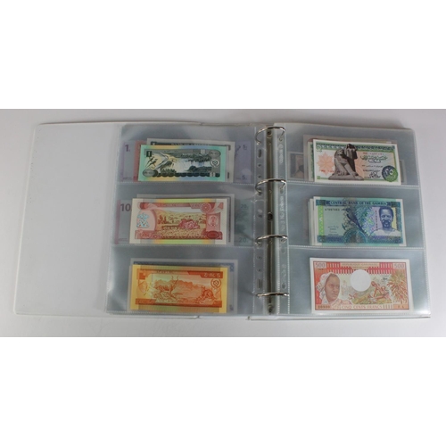 905 - World, Africa (151) a superb collection of Uncirculated notes in an album, Algeria, Angola, Biafra, ... 