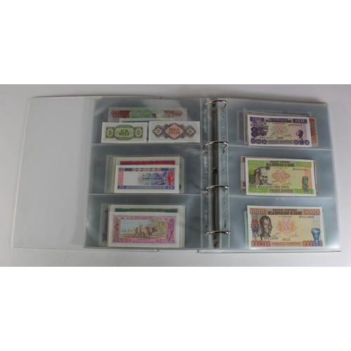 905 - World, Africa (151) a superb collection of Uncirculated notes in an album, Algeria, Angola, Biafra, ... 