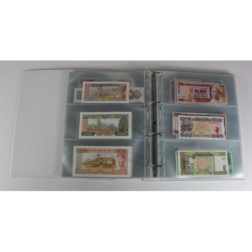 905 - World, Africa (151) a superb collection of Uncirculated notes in an album, Algeria, Angola, Biafra, ... 