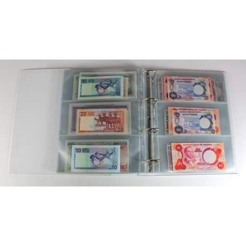 905 - World, Africa (151) a superb collection of Uncirculated notes in an album, Algeria, Angola, Biafra, ... 