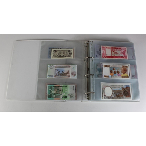 905 - World, Africa (151) a superb collection of Uncirculated notes in an album, Algeria, Angola, Biafra, ... 