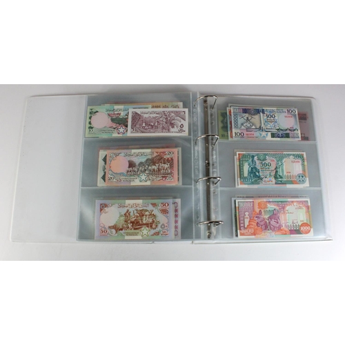 905 - World, Africa (151) a superb collection of Uncirculated notes in an album, Algeria, Angola, Biafra, ... 