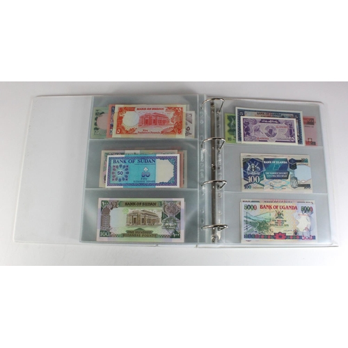 905 - World, Africa (151) a superb collection of Uncirculated notes in an album, Algeria, Angola, Biafra, ... 